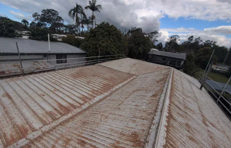 Old rusted corrugated metal roof before replacement in Runcorn